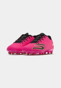 Pink soccer cleats with a textured upper, black laces, and black accents. Features molded studs in green on a translucent sole.