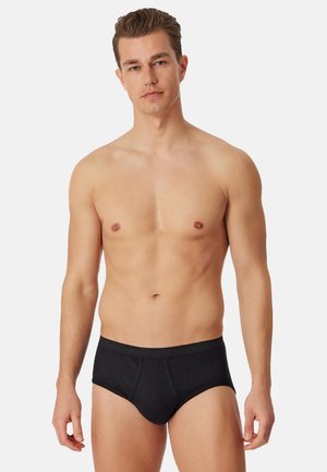 Sort bomuldsbrief med glat tekstur, elastisk linning med mærkenavn, klassisk pasform og minimalistisk design.