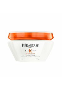 Kérastase Nutritive Masquintense Haarpflege in einem 200 ml weißen Tiegel mit orangefarbenem Deckel. Glatte Oberfläche, geschwungenes Design und klare Beschriftung.