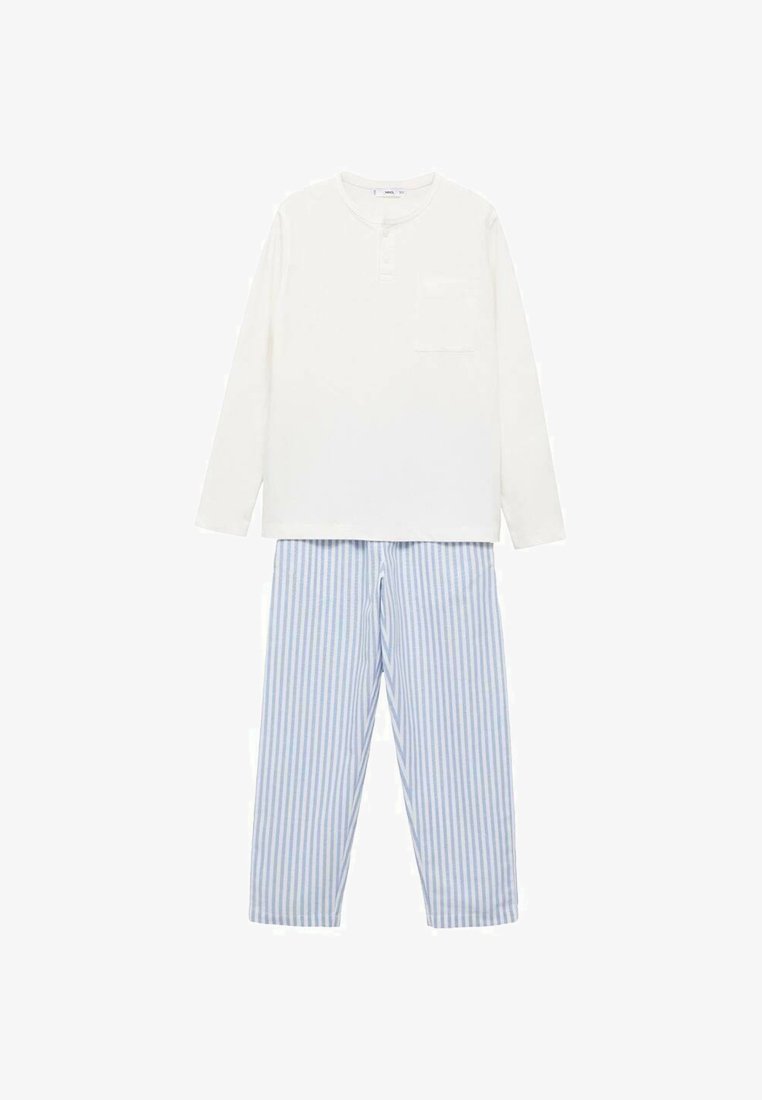 Top bianco a maniche lunghe con tasca, abbinato a pantaloni a righe blu e bianche. Tessuto leggero, vestibilità rilassata e motivi contrastanti.