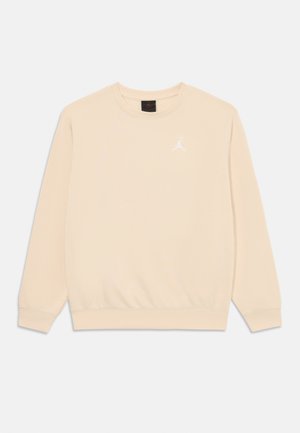 Hanorac bej dintr-un material moale, cu guler rotund și mâneci lungi. Include un mic logo alb Jordan pe piept.