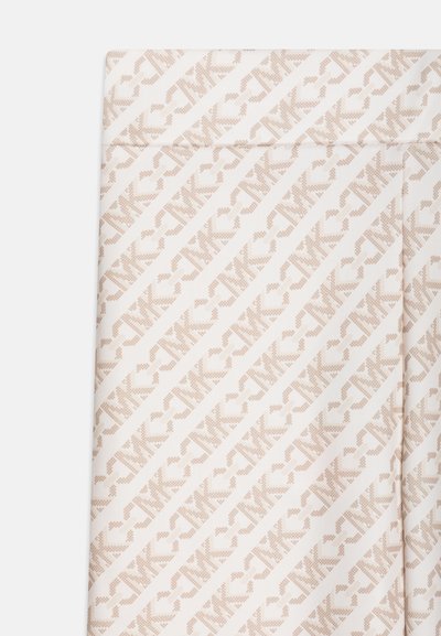 Leggings in a stretchy, white fabric featuring a diagonal, repeating light beige pattern with "NK" logos throughout.