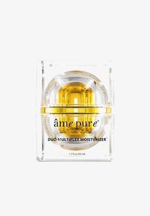 Clear square jar contains a round inner chamber filled with yellow moisturizer. Black text labels the product "âme pure Duo-Multiplex Moisturizer."