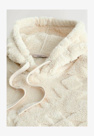 Crèmewitte fleece hoodie met een gestructureerd patroon, trekkoorden en een zachte, pluizige uitstraling. De capuchon is gevoerd en comfortabel.