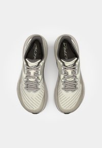 Light gray running shoes with a textured upper, featuring a lace closure, reinforced toe cap, and a cushioned sole.
