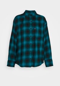 Camicia di flanella a quadri verde acqua e nera, con chiusura a bottoni, colletto, maniche lunghe e una tasca sul petto. Tessuto morbido.