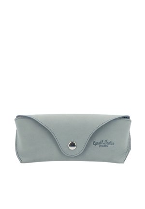 Light blue leather case with a fold-over design, snap closure, and embossed logo. Smooth texture and clean lines, suitable for glasses or accessories.