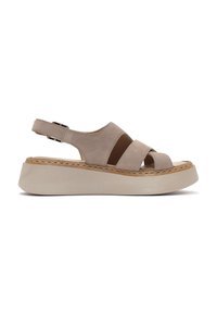 Sandali platform in suede beige con un ampio design a fascia incrociata, punta scoperta, cinturino alla caviglia regolabile e suola testurizzata di colore chiaro.