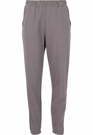 Grå joggerbyxor med elastisk midja, sidofickor och smalnande ben. Tillverkade av ett slätt, lätt material med minimal struktur.