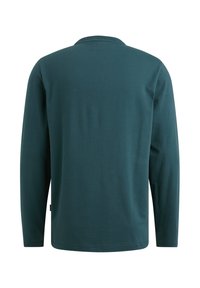 Langærmet t-shirt i dyb tealfarvet bomuld; har en rund halsudskæring og er glat tekstureret med en lige kant og minimal beklædning.