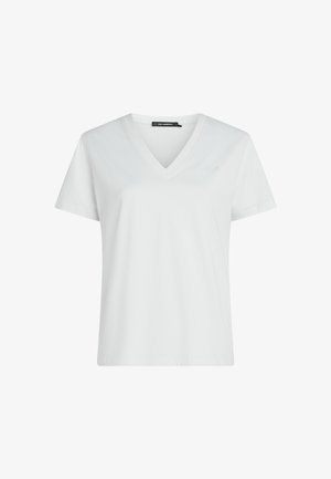 Valge lühikeste varrukatega V-kaelusega T-särk, millel on vasakul rinnal peene tikandiga logo ja krae sees must silt.