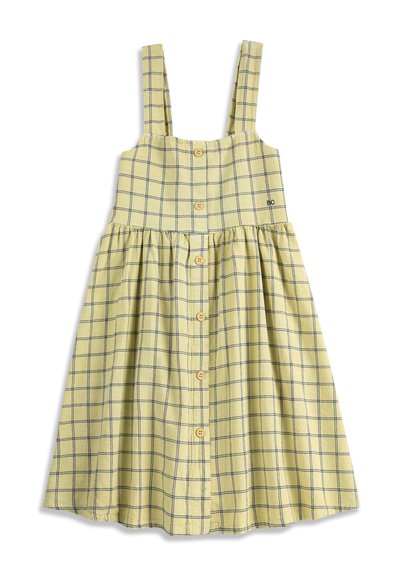 Robe jaune sans manches avec motif à carreaux bleu, boutonnage sur le devant et taille froncée, avec larges bretelles.