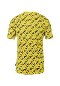 Chemise jaune à manches courtes avec un motif de vagues noires en diagonale. Fabriquée dans un matériau léger, elle possède un col rond et un ourlet droit.