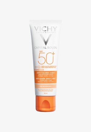 Vichy Capital Soleil tinted sunscreen in a 50 ml plastic tube. White with orange accents, labeled with SPF 50+, anti-dark spot features.