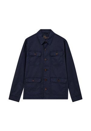 Chaqueta azul marino de algodón, con cuello puntiagudo, cierre de botones en la parte delantera y dos bolsillos en el pecho con botones marrones. Diseño de corte recto.