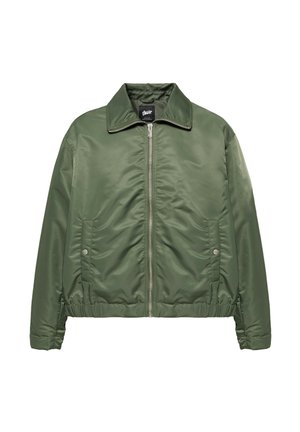 Veste verte zippée avec col, taille élastique et poches latérales à boutons-pression, présentée sur fond blanc.