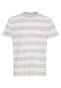 Camiseta de manga corta a rayas en blanco y beige, con cuello redondo y un bolsillo en el frente. Fabricada en suave tejido de algodón.