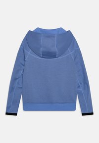 Hooded sweatshirt in two shades of blue with a textured pattern, featuring a smooth fabric section. Black accents at the cuffs.