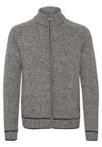 Giacca grigia in maglia con zip, collo alto, motivo testurizzato e accenti blu navy a contrasto lungo i polsini e l'orlo.