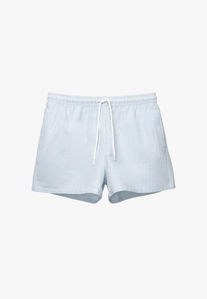 Pantaloni de baie în carouri de culoare albastru deschis, cu un brâu elastic și un șnur alb. Fabricat dintr-un material moale, dispune de o croială lejeră.