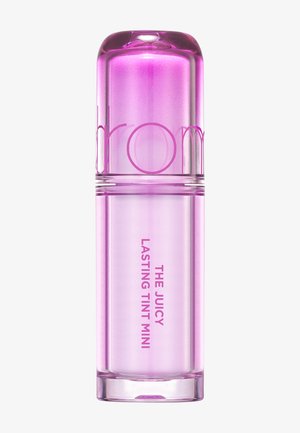 Lille cylindrisk gennemsigtig pink tube med læbepomade, rundet låg og teksten "THE JUICY LASTING TINT MINI" på kroppen.