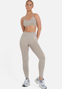 SQUATPROOF Pajkice - light brown