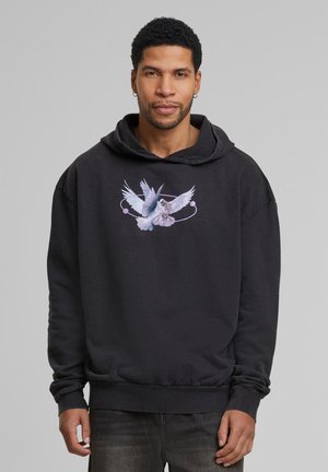 Zwarte hoodie met een grafisch ontwerp van twee vogels met lichtblauwe en paarse accenten. Heeft een relaxte pasvorm met een grote buidelzak aan de voorkant en een capuchon.