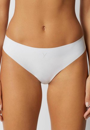 White seamless bikini made of smooth fabric; features a wide waistband and minimal coverage with an embossed logo detail at the front.