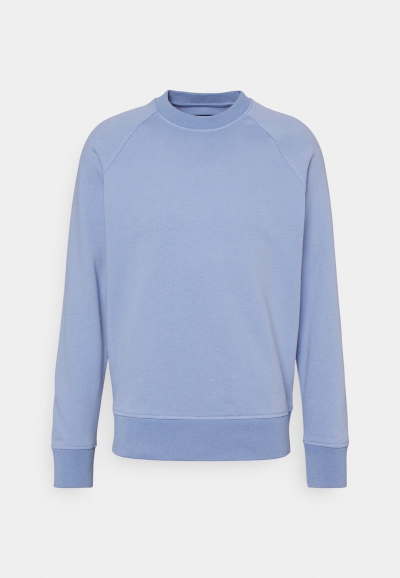 Sweat-shirt bleu clair en tissu doux, avec un col rond, des manches raglan, des poignets et un ourlet côtelés pour une coupe décontractée.