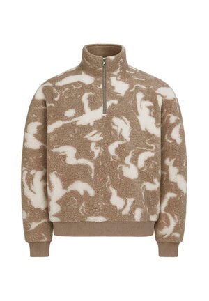 Beige fleece-pullari, jossa on valkoinen abstrakti kuvio, puoli-vetoketjukaulus, pitkät hihat sekä ribbikuvioidut hihansuut ja helma.