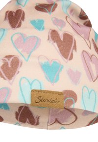 Light pink beanie with whimsical heart patterns in brown, blue, and lavender. Features a brown leather tag with "Sterntaler" engraved.