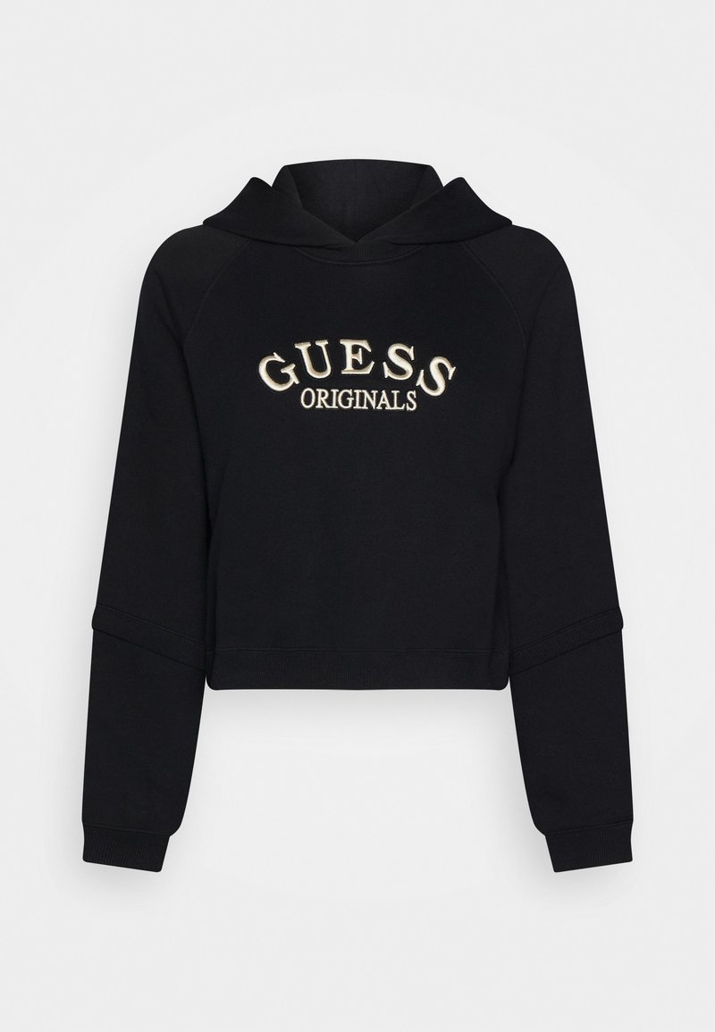 Svart kort hoodie i mjukt material, med huva och raglanärmar. "GUESS ORIGINALS" broderat i krämfärgat på framsidan.