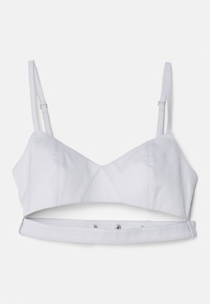 Soutien-gorge court gris clair avec bretelles ajustables, un corsage structuré et une fermeture à pression à la base pour un maintien sécurisé.