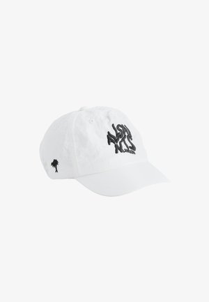 Hvid baseballkasket med sort broderet tekst "Alshan Nits London" foran og en lille palme på siden.