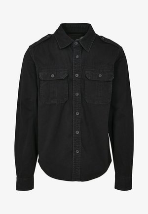 Schwarzes langärmliges Shirt aus Baumwolle. Mit einem kragenförmigen Ausschnitt, zwei Brusttaschen, Knopfleiste und strukturiertem Stoff.