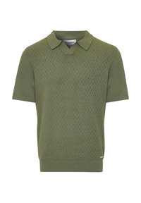 Kortærmet poloshirt i olivengrøn med et struktureret zigzag-mønster, klassisk krave og lige kant. Stoffet virker blødt og holdbart.