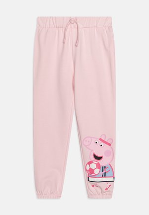 Roze joggingbroek met elastische tailleband en boorden. Voorzien van een grote gedrukte afbeelding van een cartoonvarken dat een voetbal vasthoudt.