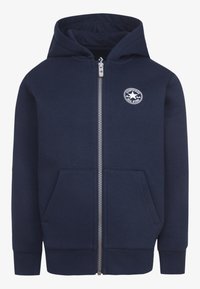 Navy blue zip-up hoodie made of soft cotton, featuring a kangaroo pocket, ribbed cuffs, and a circular logo on the left chest.