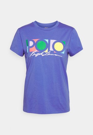 Purple cotton t-shirt featuring the "POLO" logo in multicolored geometric shapes, with script text below. Classic crew neck and short sleeves.