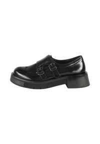 Scarpa in pelle nera con punta rotonda, dettagli decorativi in brogue, doppia fibbia e suola spessa e testurizzata. Tacco a blocco basso.