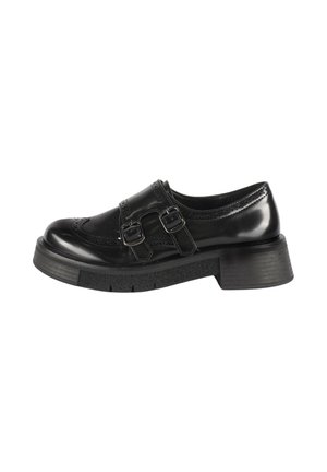 Scarpa in pelle nera con punta rotonda, dettagli decorativi in brogue, doppia fibbia e suola spessa e testurizzata. Tacco a blocco basso.