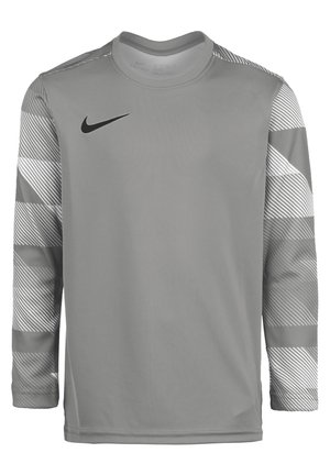 T-shirt d'entraînement gris à manches longues avec des accents rayés gris sur les manches, arborant un logo Nike noir sur la poitrine supérieure gauche.
