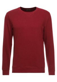 Röd långärmad sweatshirt i mjuk bomullsmix. Har rund halsringning, ribbade muddar och nederkant. Enkel, enfärgad design utan mönster.