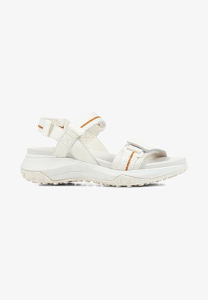 White sandals with adjustable straps, textured upper, cushioned sole, and orange accent stripe on the strap. Grooved, durable outsole.