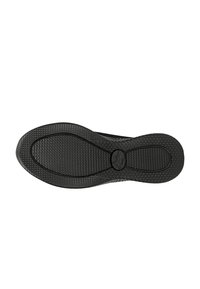 Suola di scarpa in gomma nera con superficie texturizzata, caratterizzata da modelli di trazione circolari e un logo al centro. Forma leggermente curva.