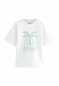 T-shirt en coton blanc avec une coupe décontractée, présentant un graphisme vert clair d'un palmier et le texte : "LOS ANGELES" avec des coordonnées en dessous.