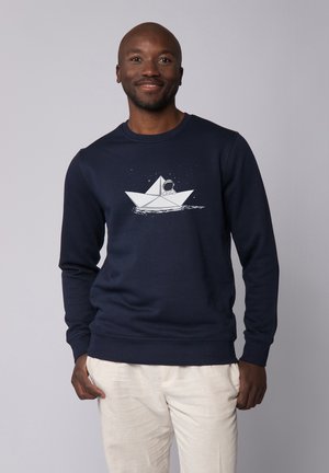 Marine sweater met lange mouwen, voorzien van een witte afbeelding van een papieren boot en astronaut. Gemaakt van gestructureerde stof met een ronde halslijn.