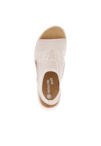 Light pink slip-on sandal with a textured knit upper, padded insole, and rubber outsole, featuring a simple and rounded toe design.