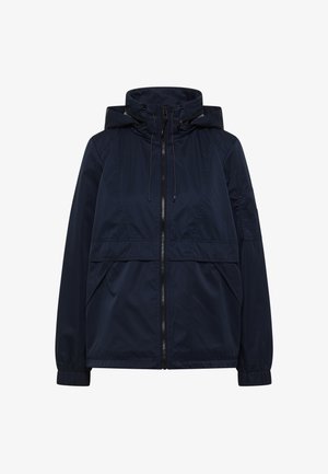 Veste coupe-vent à capuche bleu marine avec fermeture éclair frontale, capuche à cordon de serrage, poignets élastiques et deux poches avant obliques.