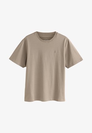 T-shirt beige en coton à manches courtes avec col rond, petit logo brodé sur la poitrine gauche, présenté sur fond blanc uni.